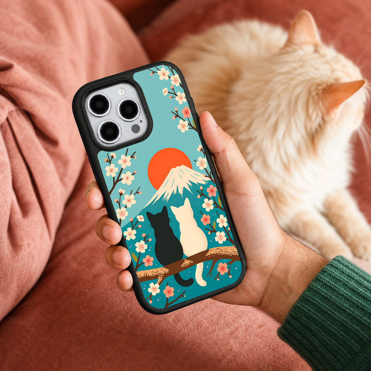 Fuji Cats iPhone 15 Pro case held in hand – lifestyle view